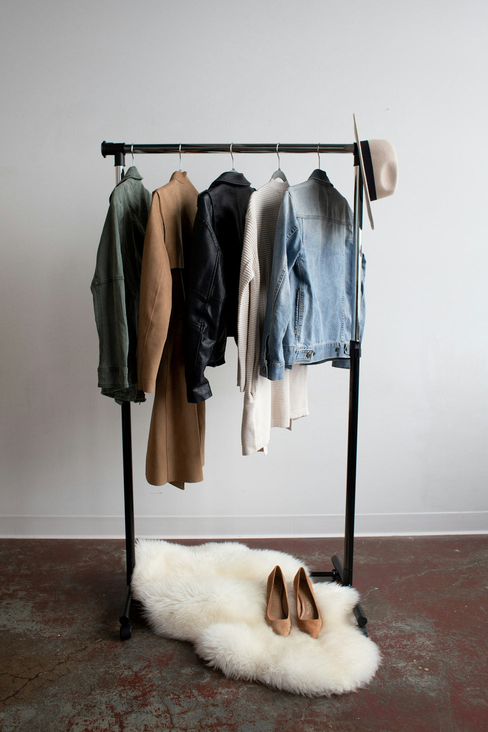 A rail of jackets presented on a rack as they would appear in a wholesale showroom for buyers