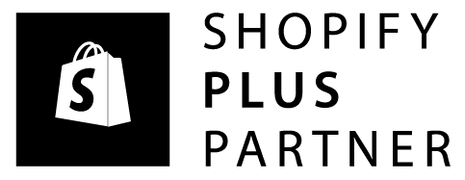 Shopify Plus Partner logo with a shopping bag icon on a black background